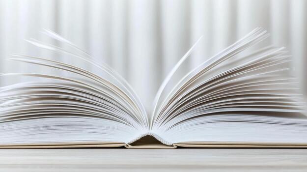 An open book on a table with a blurred background photo
