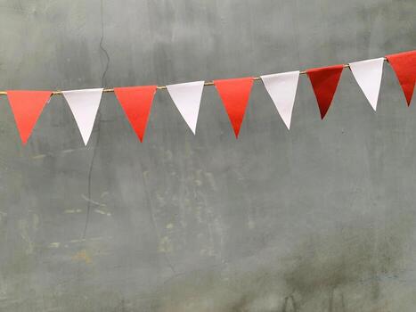A red and white bunting with a red and white flag photo