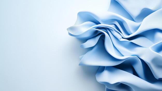 Soft blue fabric crumpled on a light background showcasing texture and elegance in a minimalist setting photo