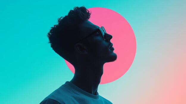 Young man in silhouette against colorful abstract backdrop contemplating life and creativity photo