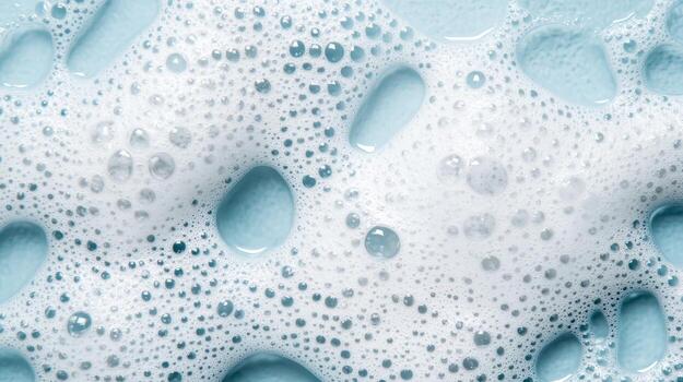 Bubbles and foam texture in soft blue tones for creative backgrounds and design elements photo