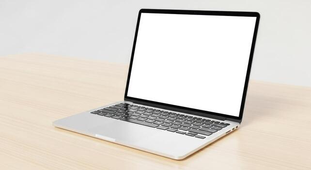 modern silver laptop computer with blank screen on desk photo