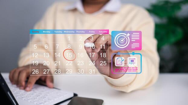 Close up of person using transparent digital calendar with highlighted date and floating icons for goals, task management, and project planning, concept of time management and productivity. photo