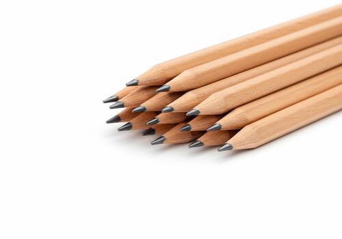 Close-up of Sharpened Wooden Pencils Arranged in a Neat Stack on White Background photo