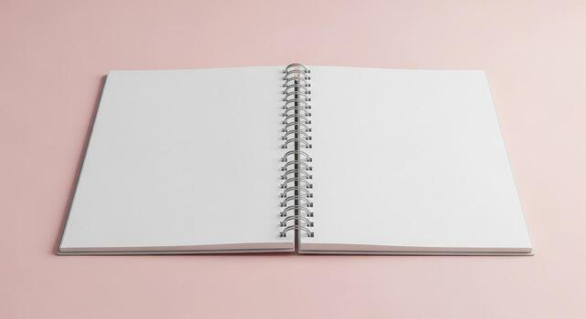 Open blank spiral bound notebook on a pink background photo