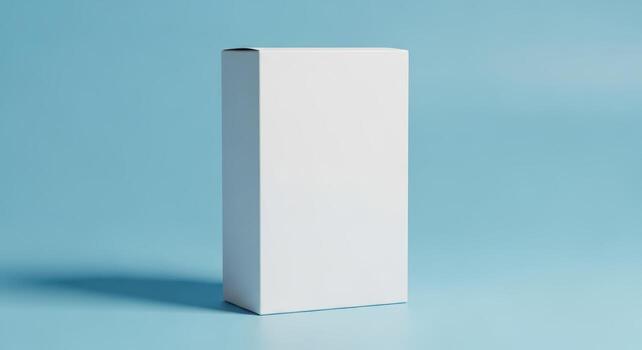 White blank box packaging isolated on blue background photo