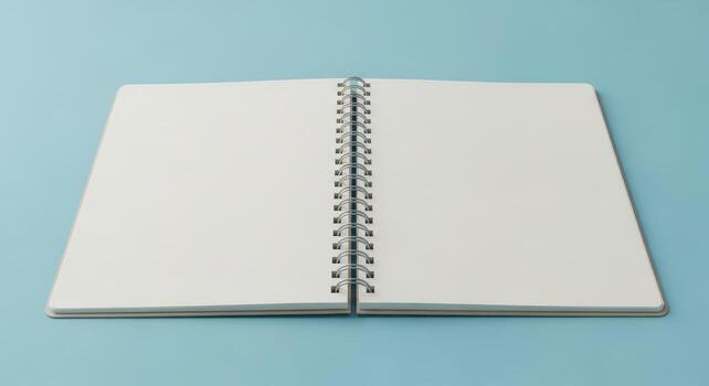 Open blank notebook with white pages and spiral binding on blue background photo