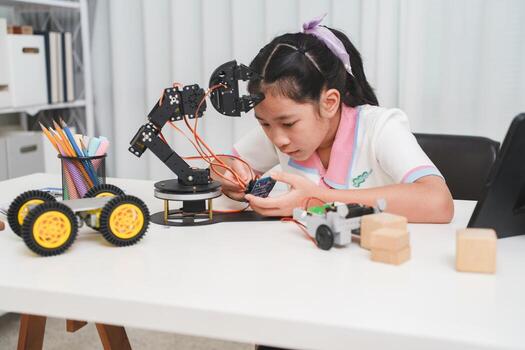 STEM education concept, a smart child learning robotics and programming at home. photo