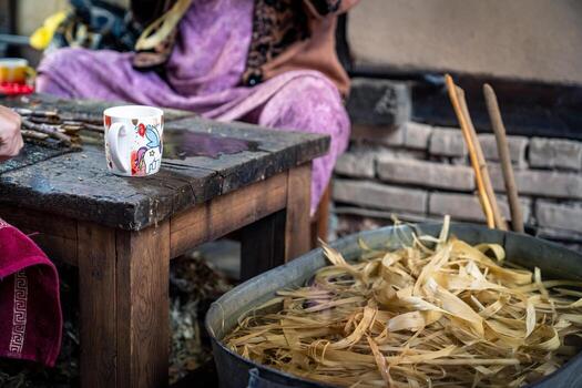 Samarkand, Uzbekistan-august 13, 2023-Craftsmen at the Konigil paper mill, where you can learn about the unique way of producing paper from the mulberry tree photo