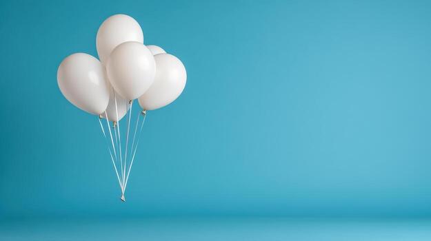 White balloons floating in the air on a blue background photo