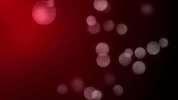 abstrakt bokeh lampor mot en lutning röd och svart bakgrund för design och festlig syften video