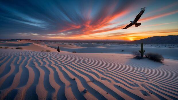 Eagle Soaring Over Desert Dunes at Colorful Sunset with Cactus photo
