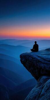 Contemplation at sunset overlooking serene mountain ranges photo