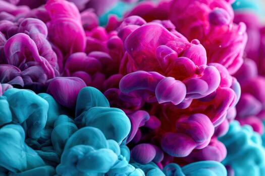 Pink and turquoise ink flowing and mixing together, close up photo