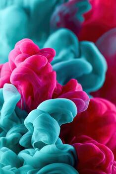 Swirls of turquoise and magenta ink dissolving in liquid photo