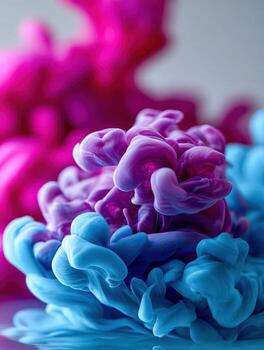 Colorful ink swirling in water creates abstract shapes photo