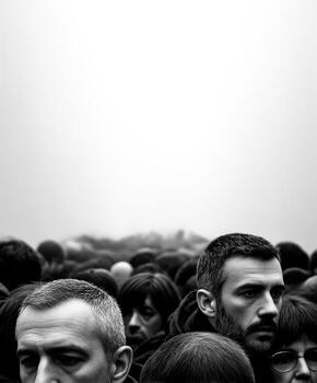 Crowd of people gather outside during the daytime in grayscale photo