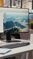 Wind turbine CAD design software used for sustainable energy research in engineering office. Software interface on PC with digital modeling of wind energy generator infrastructure video