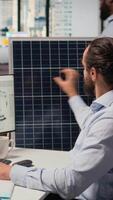 Engineer in office working on solar panel CAD design to develop technology improving environmental performance. RD expert coming up with innovative materials for PV solar cells, camera A video
