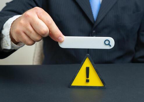 Searching for a solution to a problem on the Internet. Warning sign and search bar, online advice, digital assistance, troubleshooting, cyber risk, tech help, knowledge access photo