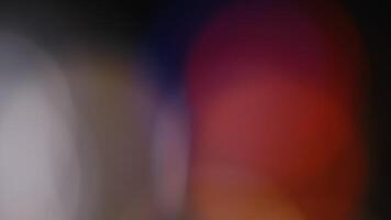 Multicolored light leaks 4k footage on black background. Lens studio flare leak burst overlays. Natural lighting lamp rays bokeh effect. For compositing over your footage, stylizing , transitions video