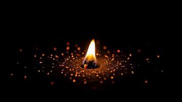 Minimalist design of tiny flame glowing softly with floating ember particles video