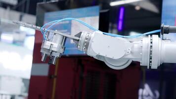 Robotic arm moving with precision in a technological environment. Media video