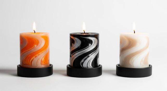 Three decorative candles with swirling patterns isolated on white background, creating a warm and inviting atmosphere for relaxation or celebration photo