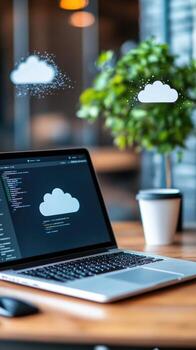 Cloud computing and software development on laptop computer with cloud icon photo