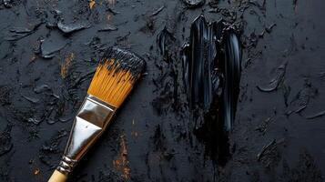 Black Paintbrush on Textured Canvas A Study in Darkness and Texture photo