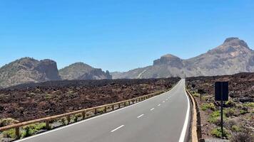 The road is empty and the mountains are in the distance video