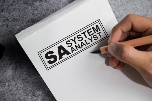 Concept of SA - System Analyst write on book isolated on Wooden Table. photo