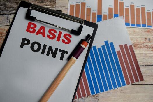Concept of Basis point write on clipboard isolated on Wooden Table. photo