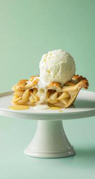 Apple pie slice topped with vanilla ice cream photo