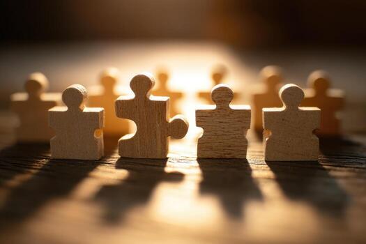 Close-up of wooden puzzle pieces, lit from the front, forming a circle photo