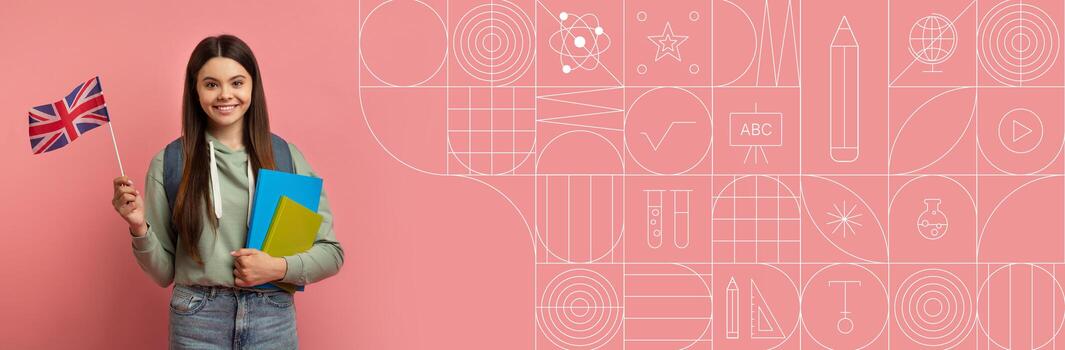 A student stands confidently with a British flag and a stack of books in her hands. She is surrounded by a painted pink background that features educational elements, creating an inspiring atmosphere. photo