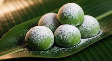 Green Tea Mochi Balls on a Tropical Leaf photo