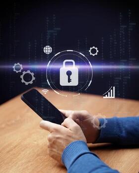 Digital security and technology concept with hands using smartphone at a wooden table with graphical interface elements photo