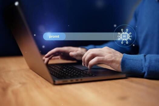 Individual typing on a laptop with AI prompt search bar illuminated in a dimly lit workspace setting at night photo