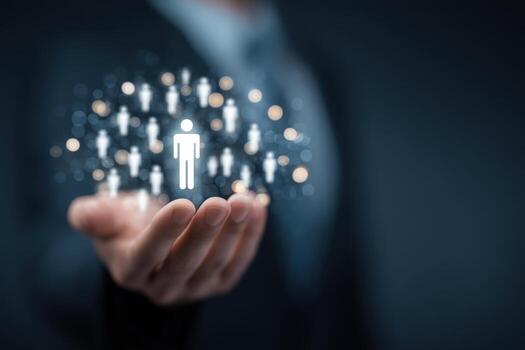 Hands holding a digital social network connecting human icons and a central person symbol photo