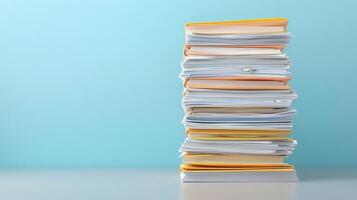 Stack of documents on blue background photo