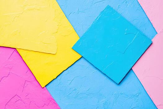 Vibrant colored papers arranged on a textured surface for artistic background design photo