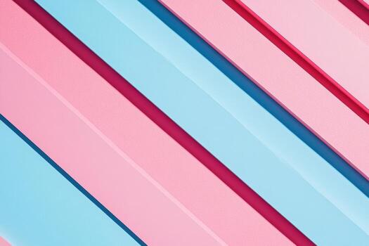 Colorful diagonal stripes of pink and blue create a vibrant abstract pattern on a surface photo
