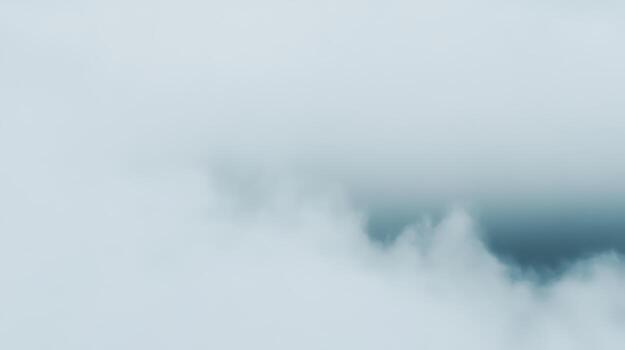 Soft gray clouds hover in a serene sky during early morning hours photo