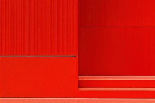 Striking modern architecture featuring bold red walls and geometric shapes in urban setting photo