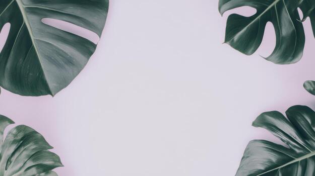 Tropical green leaves creating a stylish background pattern on a light surface photo