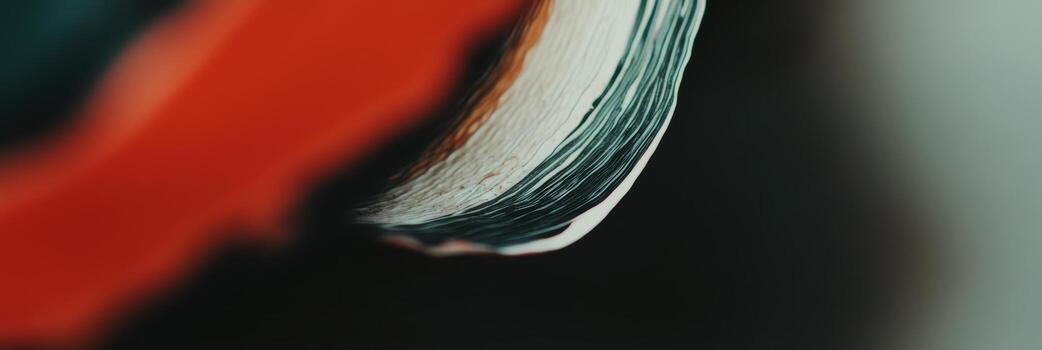 Book edge reveals vibrant colors in a close-up view during a cozy reading session at home photo