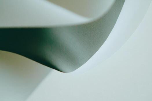 Curved paper layers creating a minimalist design in soft tones photo