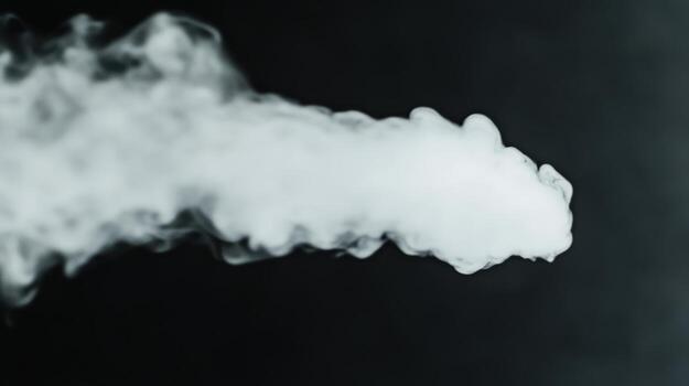 Smoke billowing upward creating an abstract pattern against a dark background photo