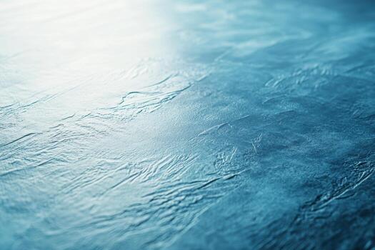 Textured surface reflecting light in shades of blue with a smooth finish photo